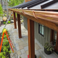 Why Do Rain Gutters Matter For Homes With Natural Stone Building Materials In Manchester, New Hampshire?